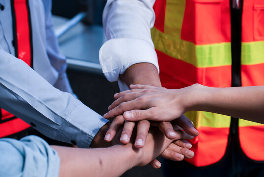 Engineer wearing mask , helmet standing cargo at the container yard and Check container integrity Before exporting products abroad. Shipping import, export industrial and logistics concept.