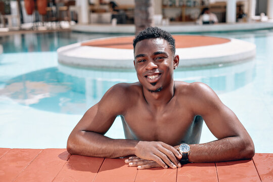  afro american young man relaxing in the pool. Shirtless male model sunbathing. Shirtless male model sunbathing. Swaggy C on the beach. Phuket.