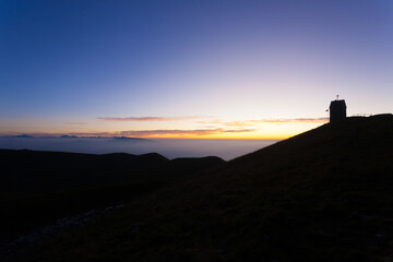 Dawn at the little church, mount Grappa landscape, Italy