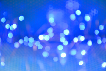 blue festive background with bright blurry lights, suitable for christmas, new year and other holidays