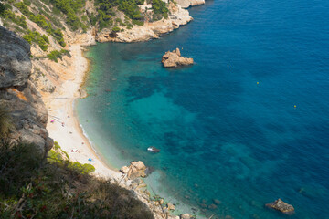 Beautiful Cala Ambolo (cove, small bay), paradise beach with turquoise water down a cliff. Close to...