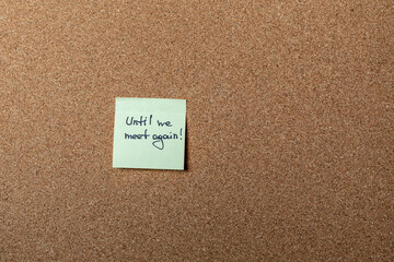 green sticker on brown table. color sticker, motivational, quote and words, note, message