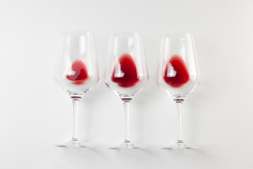 Glasses with red wine on white background. Wine flat lay, top view, degustation, holyday concept.