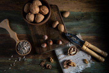 Nuts and sunflower seeds on a rustic table