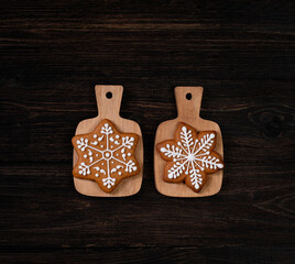 Various christmas gingerbread stars on dark table