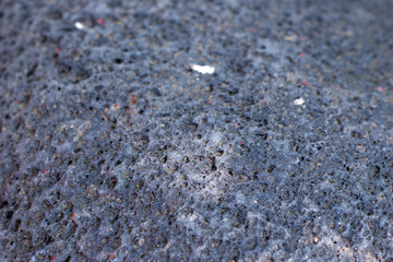Background of black porous natural stone.