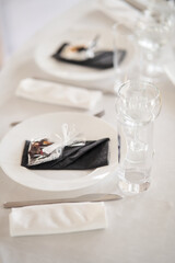 Fototapeta na wymiar Table set for an event party or wedding reception.
