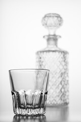 Decorated carafe and a small water glass. Decorative containers for serving water and alcohol.