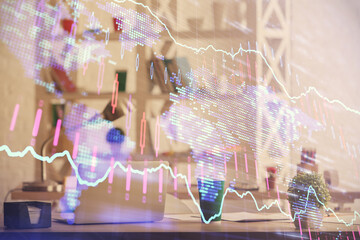 Double exposure of stock market graph drawing and office interior background. Concept of financial analysis.