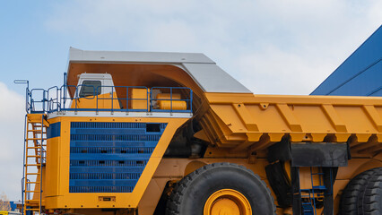 The worlds biggest truck with electric drive system consisting of four electric motors. Mining two-axle all-wheel-drive dump truck with weight-carrying capacity of 450 metric tons. 