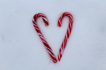 heart of caramel canes on the snow