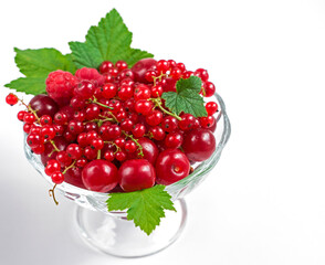 summer berries on a white background, red currant, cherry, raspberry