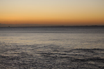Sky at sunrise and sea in pastel colors