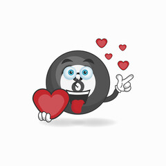 Billiard ball mascot character holding a love icon. vector illustration