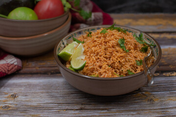 Authentic Mexican Spanish rice in ceramic bowl against gray table, copy space