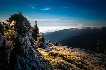 View from mountain range to the valley above fog and clouds, high altitude landscape of stone and...