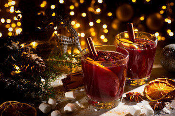 Two glasses of mulled wine on christmas decorations