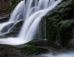 Obraz premium Wild brook with stones and waterfall in Jeseniky mountains, Eastern Europe, Moravia. Clean fresh cold watter, water stream. Long exposure image. .