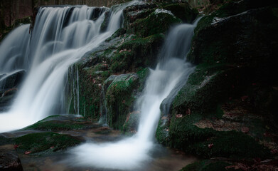 Wild brook with stones and waterfall in Jeseniky mountains, Eastern Europe, Moravia. Clean fresh cold watter, water stream. Long exposure image. .