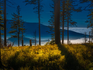 View from mountain range to the valley above fog and clouds, high altitude landscape,sun,blue...