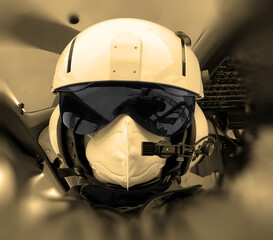 BERLIN, GERMANY - Nov 14, 2020: Helicopter Pilot on rescue Helicopter with Covid-19 Face Protection