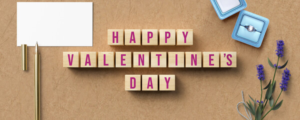 cubes with message HAPPY VALENTINE'S DAY and romantic decoration on paper background