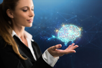 businesswoman interacting with a virtual brain in front of blue background