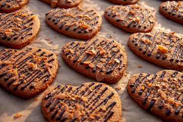 Selective Focus, soft focus, tasty cookies with chocolate on baking tray
