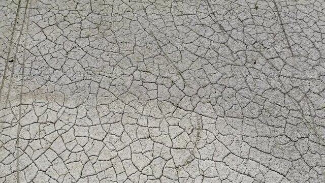Top down view of a dry lake. Many cracks in the ground at a depth of a lake that has been dry for a long time ago..