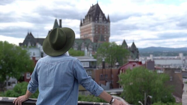 A nice tourist man with cheateau frontenac on the back