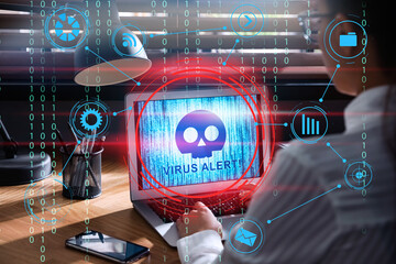 Woman using laptop with warning about virus attack on screen, closeup