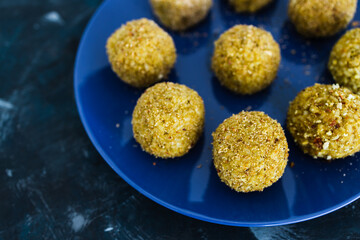 plant-based food, homemade fried vegan pesto risotto balls arancini