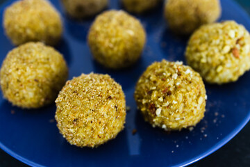 plant-based food, homemade fried vegan pesto risotto balls arancini