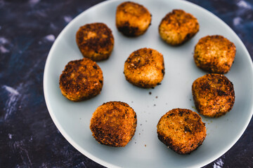 plant-based food, homemade fried vegan pesto risotto balls arancini