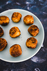plant-based food, homemade fried vegan pesto risotto balls arancini