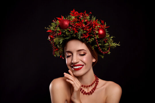 Beautiful Young Woman Wearing Christmas Wreath On Black Background