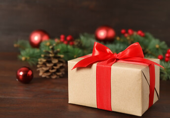 Christmas gift box on wooden table, closeup