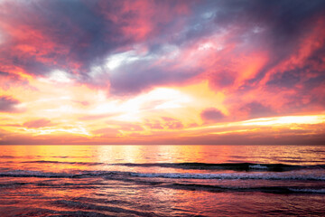 Fototapeta na wymiar Beach at sunset with colorful sky, 
