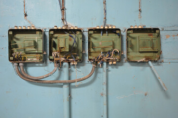 Old rusty appliances on wall in abandoned plant Jupiter in Chernobyl zone