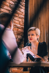 Business meeting inside a cafe with the focus through a fence.