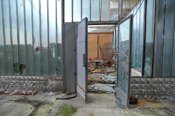 Door in shops of abandoned plant Jupiter in Chernobyl zone