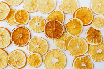 Christmas, winter, new year composition. Slices of dry oranges on white background. Natural Citrus fruits pattern. Food background. Flat lay, top view