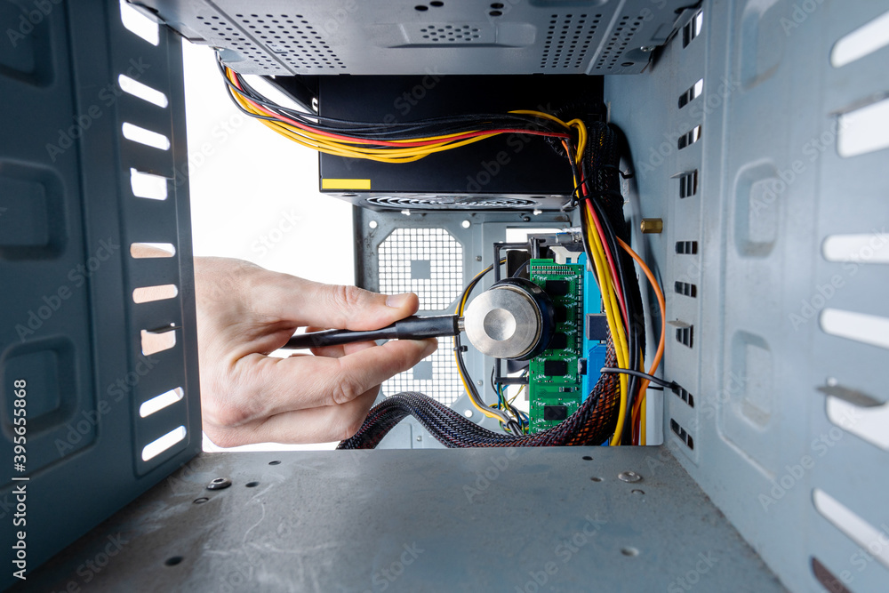 Poster technician worker repair and adjusting desktop pc hardware equipment. man using tools for repair com