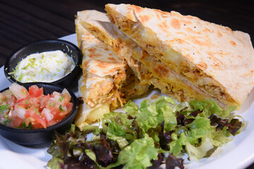 Burritos wraps with beef and vegetables on black background. Beef burrito, mexican food. Banner