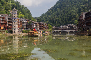 Naklejka premium Riverside buildings and Wanming Pagoda in Fenghuang Ancient Town, Hunan province, China