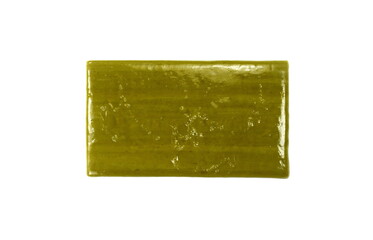 Hand made Olive Soap bar with foam isolated on white background. Wet bar of soap.