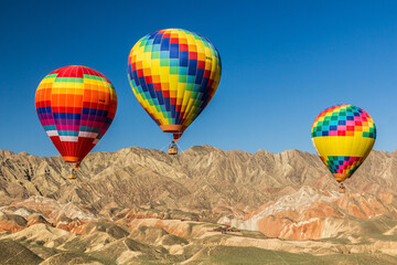 Hot air balloons in Zhangye Danxia National Geopark, Gansu Province, China