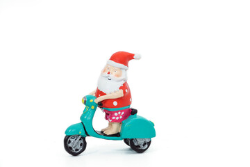 Concept image for relaxation and leisure activities showing a Santa riding a motor scooter Christmas decoration.