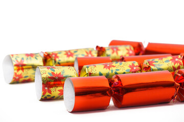 Close-up view of colourful Christmas  crackers isolated against a white background.