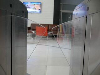closeup of sliding barrier security system in office.